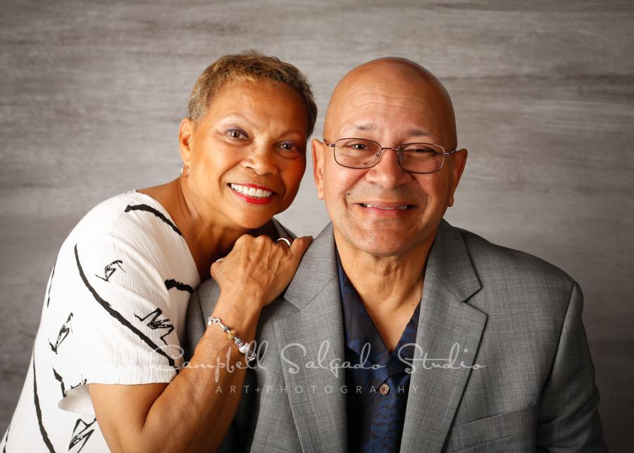  Portrait of couple on graphite background by couples photographers at Campbell Salgado Studio in Portland, Oregon. 