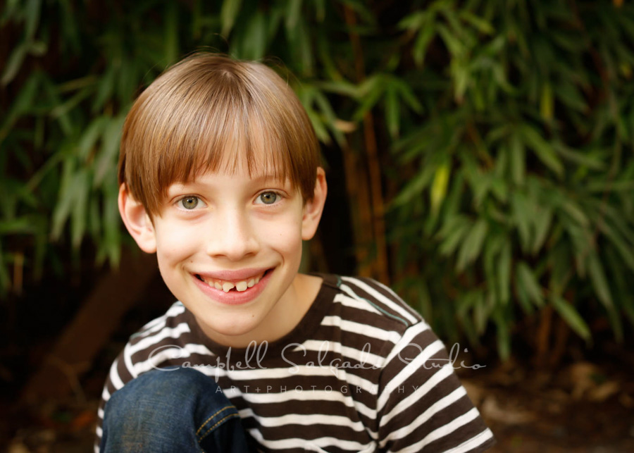  Portrait of boy on bamboo background by child photographers at Campbell Salgado Studio in Portland, Oregon. 