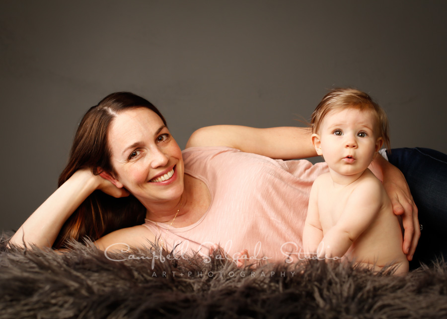  Portrait of mom and baby on grey background by family photographers at Campbell Salgado Studio in Portland, Oregon. 