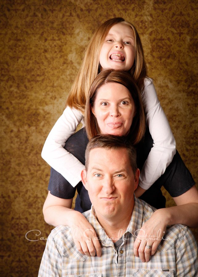  Portrait of family on amber light background by family photographers at Campbell Salgado Studio in Portland, Oregon. 