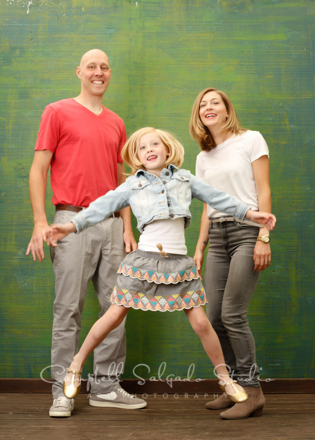  Portrait of family on blue green weave background by family photographers at Campbell Salgado Studio in Portland, Oregon. 