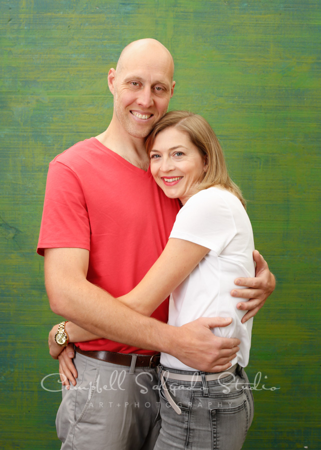  Portrait of couple on blue green weave background by family photographers at Campbell Salgado Studio in Portland, Oregon. 