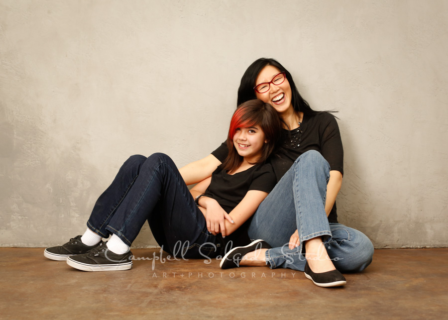  Portrait of mother and daughter on modern grey background by family photographers at Campbell Salgado Studio in Portland, Oregon. 