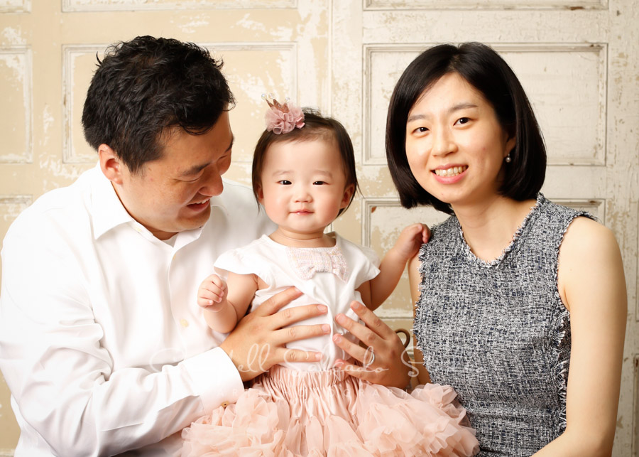  Portrait of family on antique white doors background by family photographers at Campbell Salgado Studio in Portland, Oregon. 