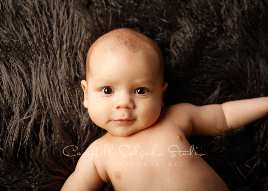  Portrait of baby on blankies background by newborn photographers at Campbell Salgado Studio in Portland, Oregon. 