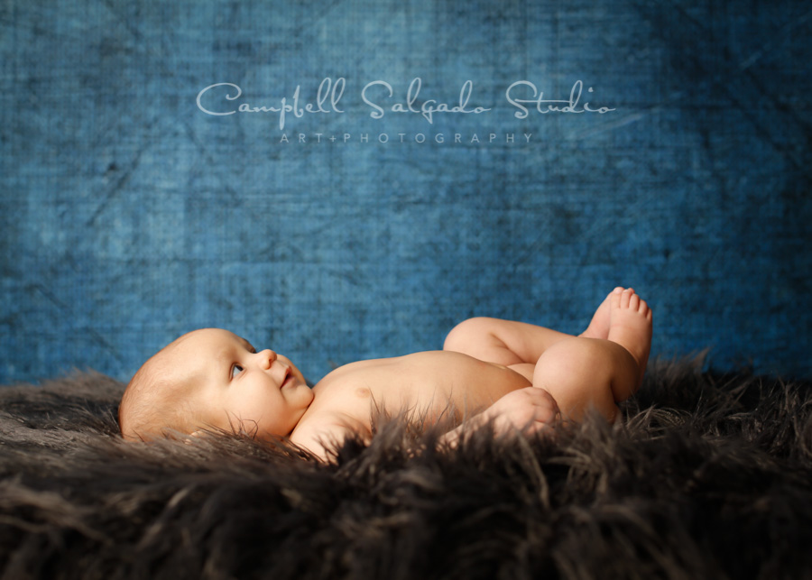  Portrait of baby on denim background by newborn photographers at Campbell Salgado Studio in Portland, Oregon. 