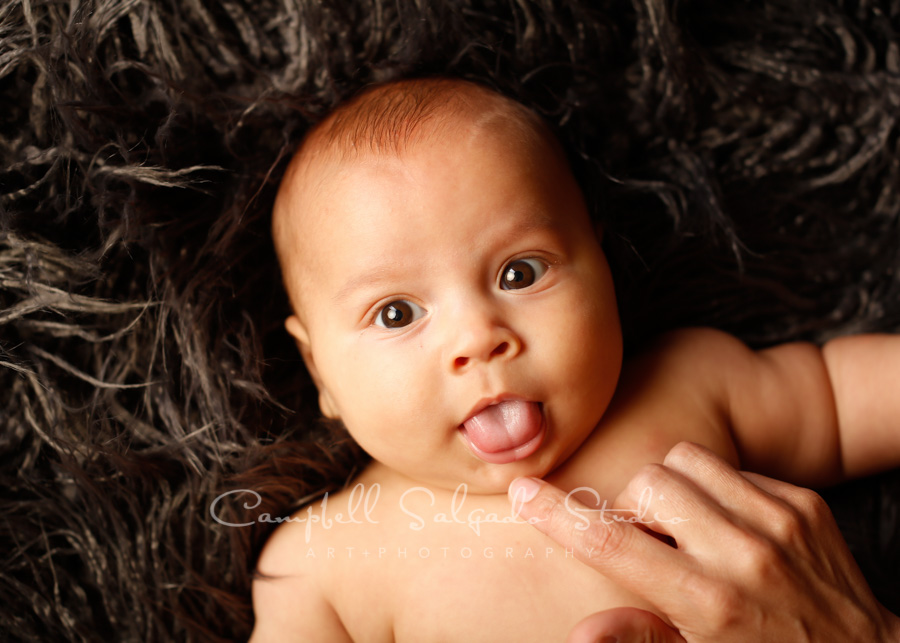  Portrait of baby on blackies background by child photographers at Campbell Salgado Studio in Portland, Oregon. 
