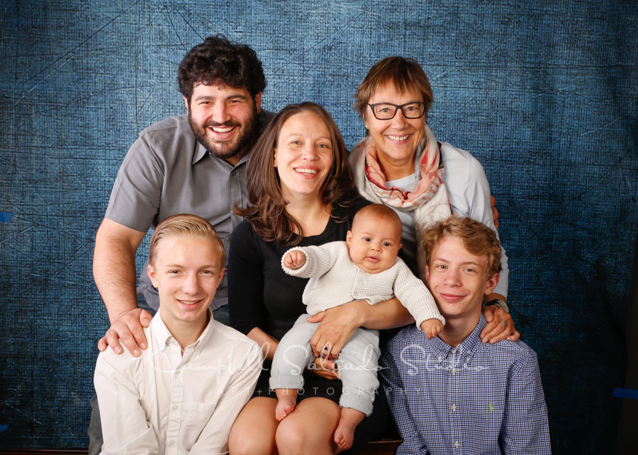  Portrait of family on denim background by famiily photographers at Campbell Salgado Studio in Portland, Oregon. 