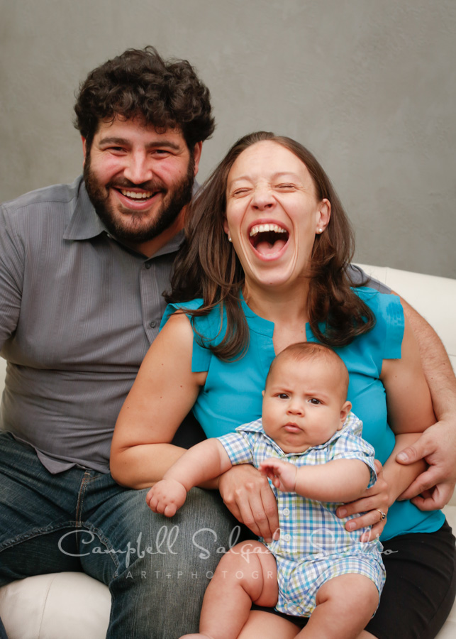 Portrait of family on modern gray background by family photographers at Campbell Salgado Studio in Portland, Oregon.