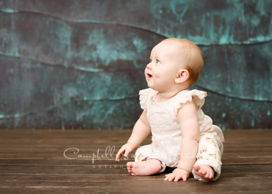  Portrait of baby on copper wave background by child photographers at Campbell Salgado Studio in Portland, Oregon. 