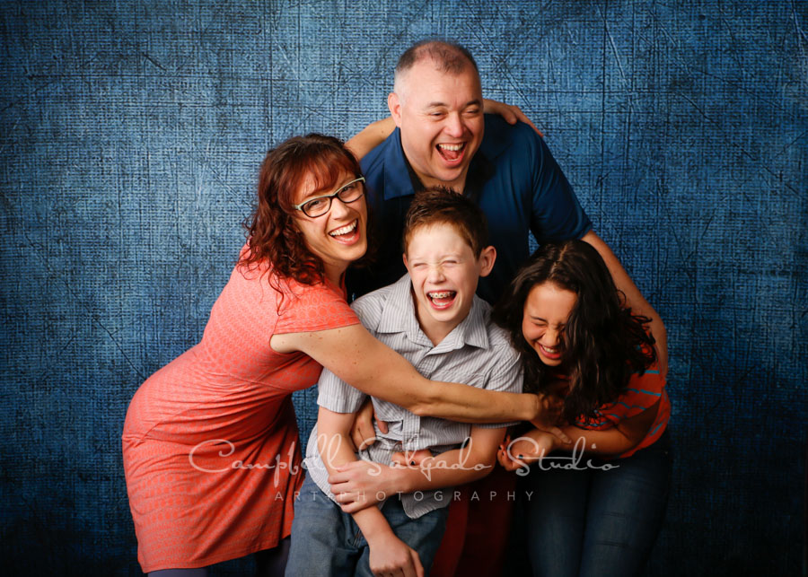  Portrait of family on denim background by family photographers at Campbell Salgado Studio in Portland, Oregon. 