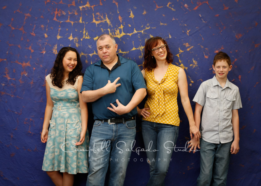  Portrait of family on the Frida background by family photographers at Campbell Salgado Studio in Portland, Oregon. 