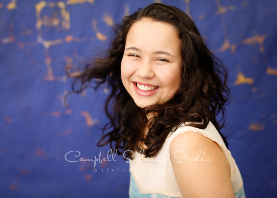  Portrait of girl on the Frida background by teen photographers at Campbell Salgado Studio in Portland, Oregon. 