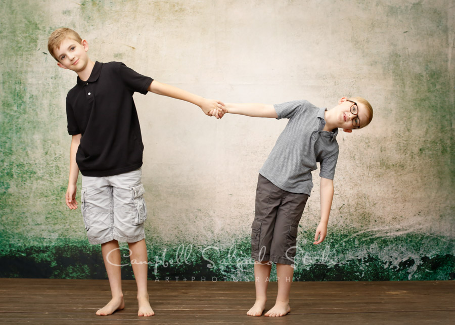  Portrait of boys on abandoned concrete background by family photographers at Campbell Salgado Studio in Portland, Oregon. 