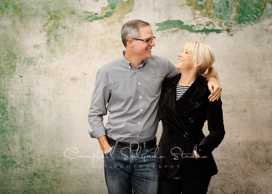  Portrait of couple on abandoned concrete background by family photographers at Campbell Salgado Studio in Portland, Oregon. 