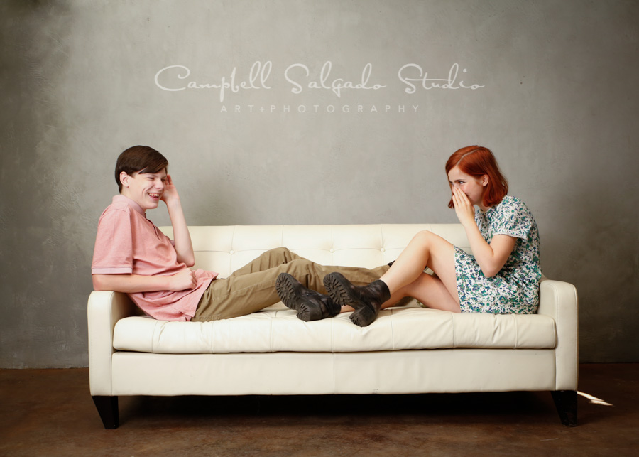  Portrait of teens on modern gray background by family photographers at Campbell Salgado Studio in Portland, Oregon. 