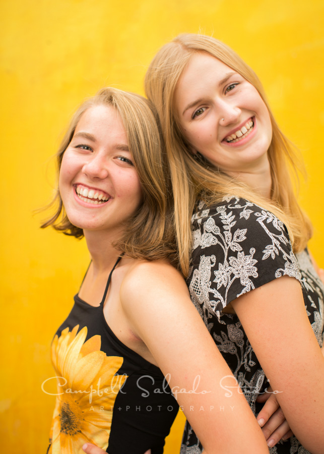  Portrait of sisters on liquid sunshine background by teen photographers at Campbell Salgado Studio in Portland, Oregon. 