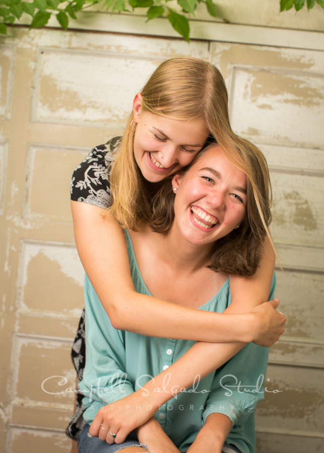  Portrait of sisters on antique white doors background by teen photographers at Campbell Salgado Studio in Portland, Oregon. 