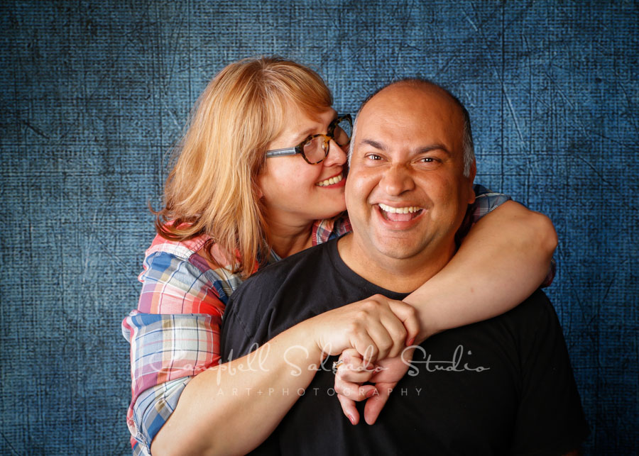  Portrait of couple on denim background by couples photographers at Campbell Salgado Studio in Portland, Oregon. 