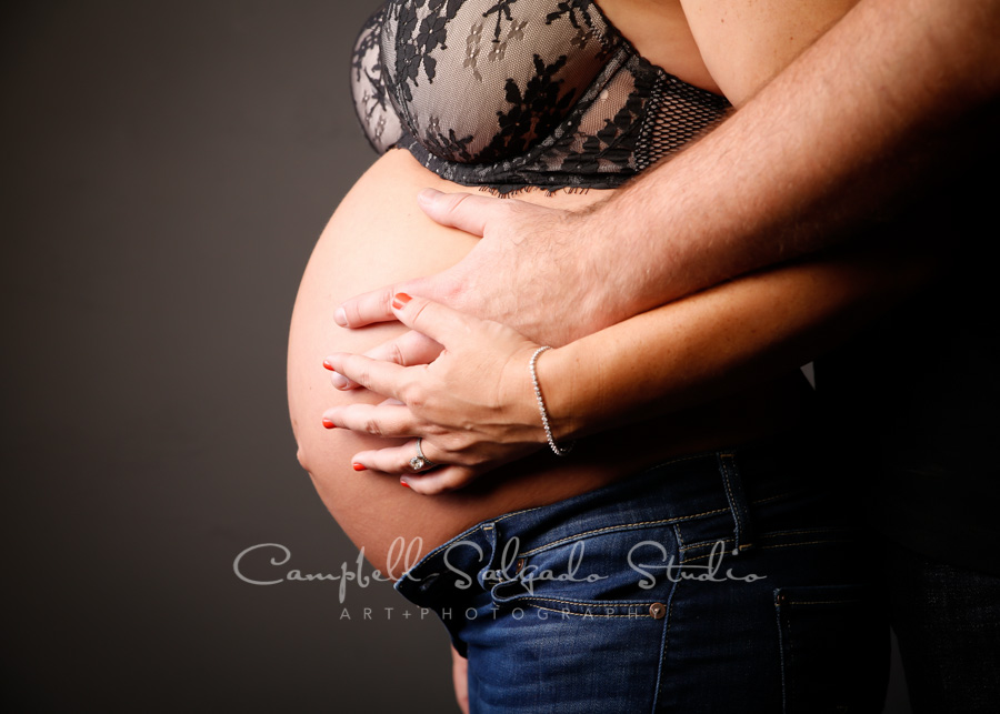  Maternity portrait of couple on grey background by maternity photographers at Campbell Salgado Studio in Portland, Oregon. 