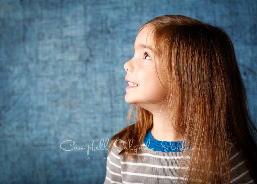  Portrait of girl on denim background by child photographers at Campbell Salgado Studio in Portland, Oregon. 