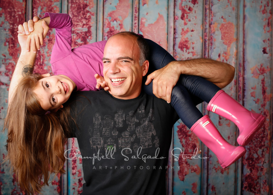  Portrait of father and daughter on Italian rust backgorund by family photographers at Campbell Salgado Studio in Portland, Oregon. 