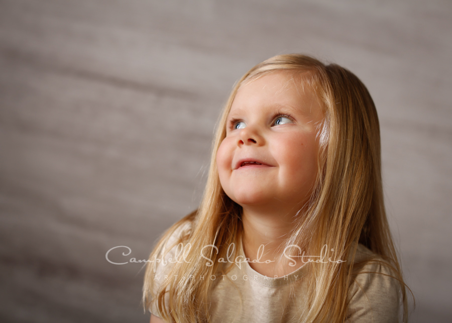  Portrait of child on graphite background by child's photographers at Campbell Salgado Studio in Portland, Oregon. 