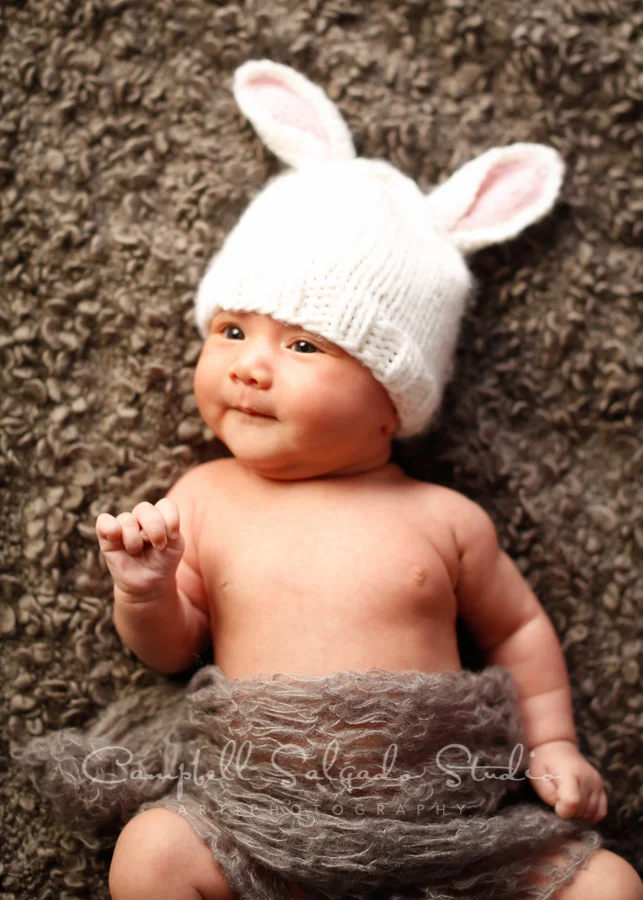 Portrait of baby on blankies background by newborn photographers at Campbell Salgado Studio in Portland, Oregon.