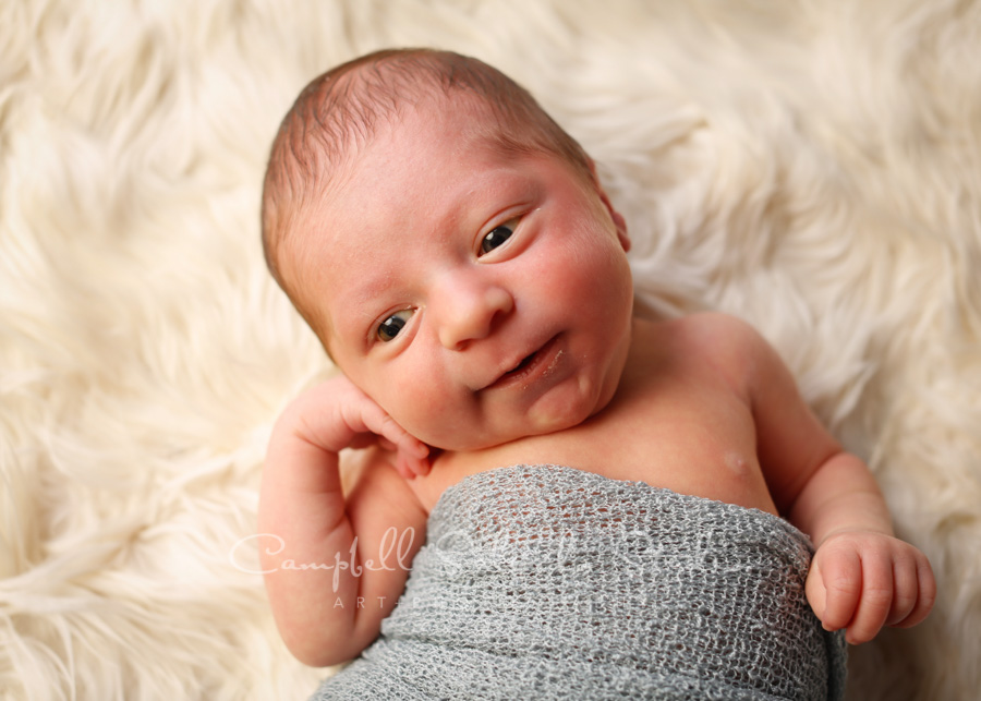  Portrait of infant on alpaca background by newborn photographers at Campbell Salgado Studio in Portland, Oregon. 