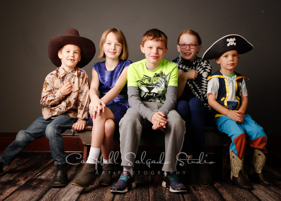  Portrait of kids on gray background child photographers at Campbell Salgado Studio in Portland, Oregon. 