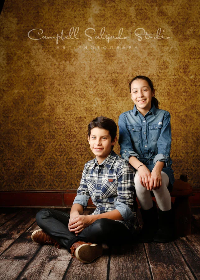 Portrait of kids on amber light background by child photographers at Campbell Salgado Studio in Portland, Oregon.