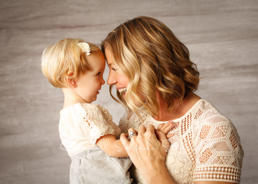  Portrait of mother and daughter on graphite background by family photographers at Campbell Salgado Studio in Portland, Oregon. 