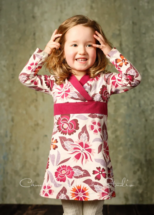 Portrait of child on rain dance background by child photographers at Campbell Salgado Studio in Portland, Oregon.