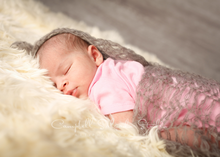  Portrait of newborn on graphite background by newborn photographers at Campbell Salgado Studio in Portland, Oregon. 