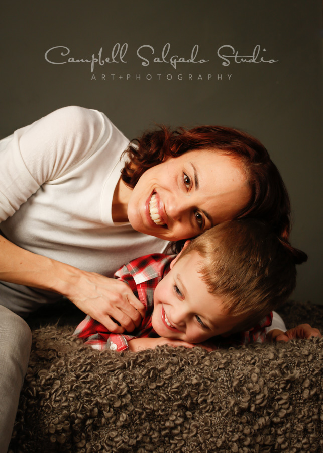  Portrait of mother and son on gray background by family photographers at Campbell Salgado Studio in Portland, Oregon. 