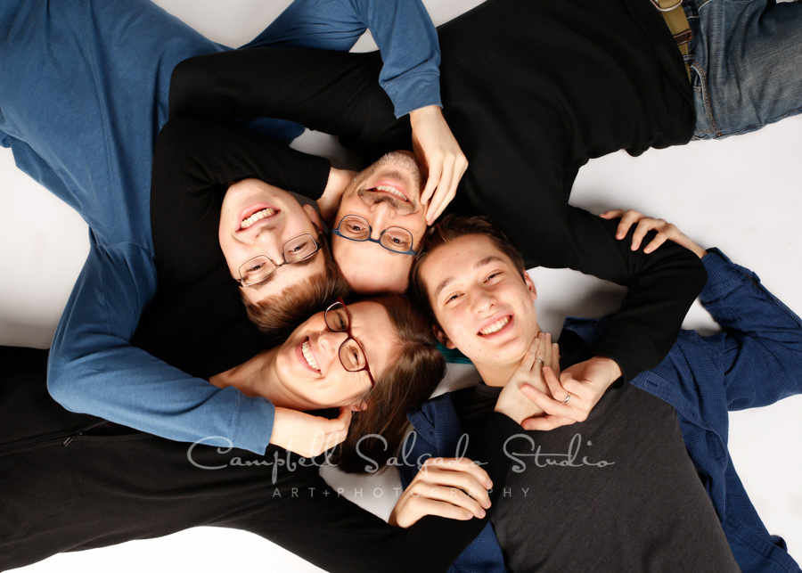  Portrait of family on white background by family photographers at Campbell Salgado Studio in Portland, Oregon. 