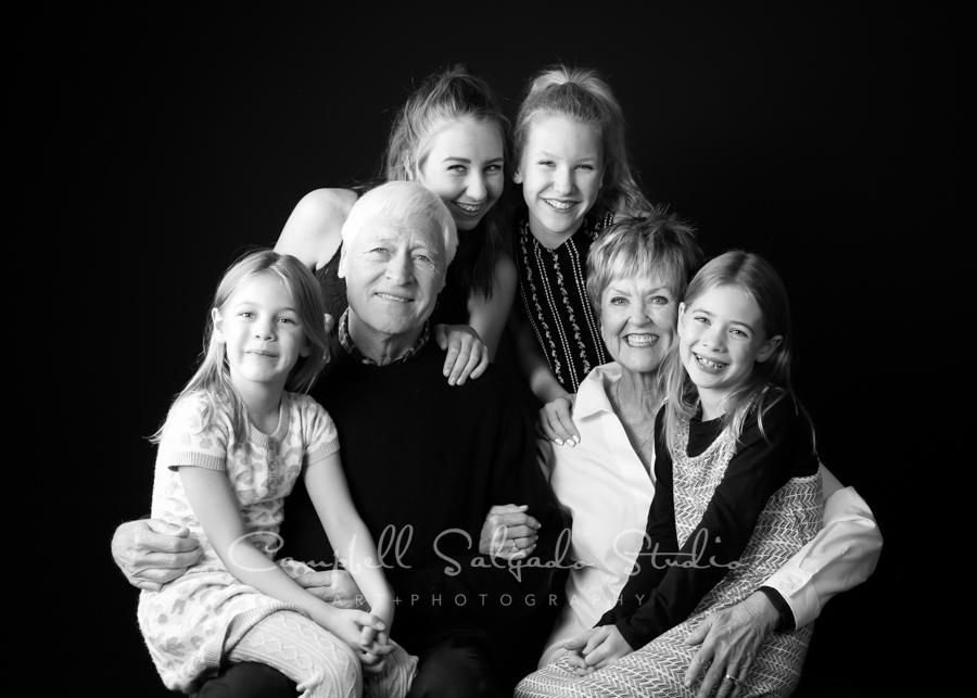  B&amp;W portrait of multi-generational family on black background by family photographers at Campbell Salgado Studio in Portland, Oregon. 