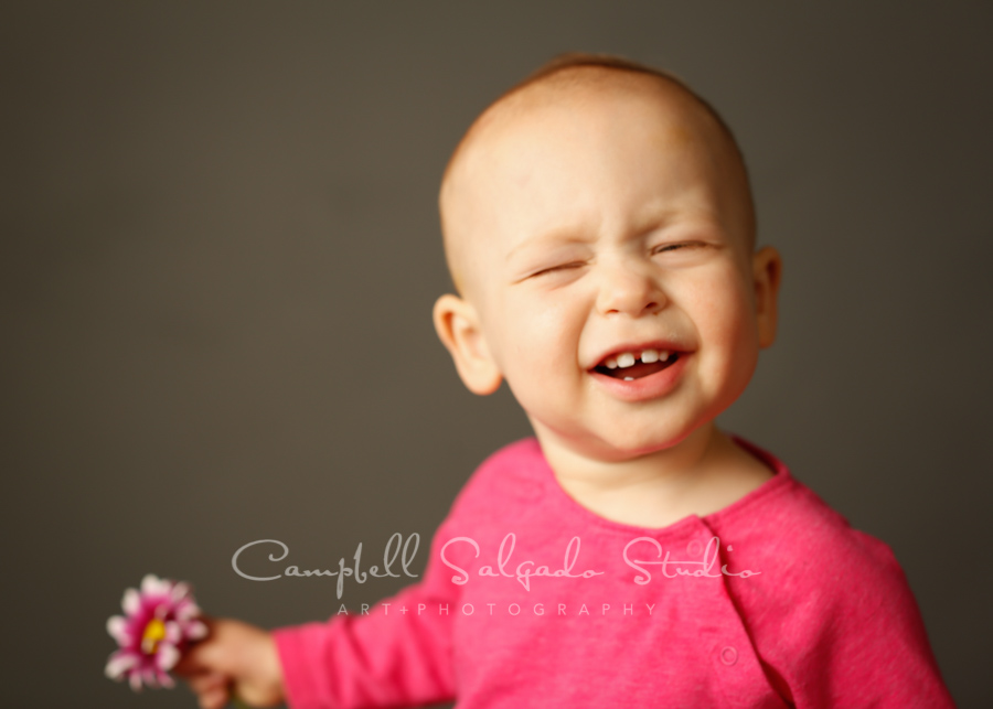  Portrait of child on grey background by family photographers at Campbell Salgado Studio in Portland, Oregon. 