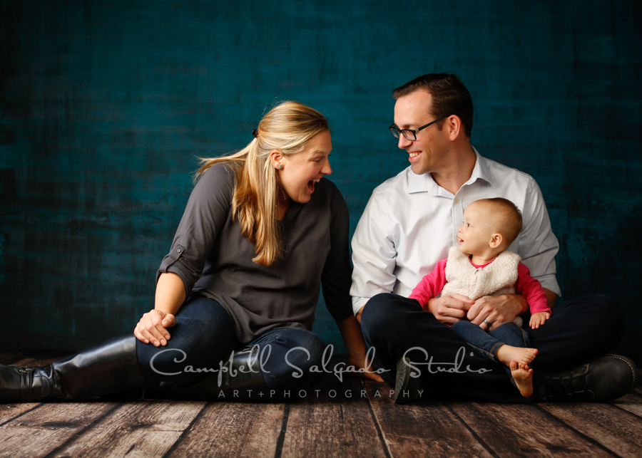  Portrait of family on deep ocean background by family photographers at Campbell Salgado Studio in Portland, Oregon. 