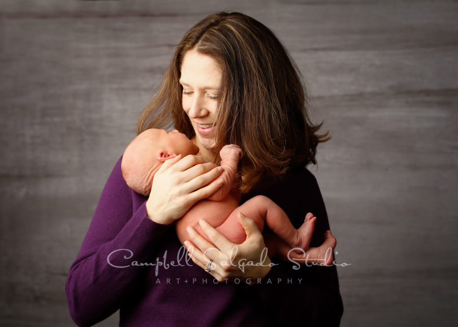  Portrait of newborn on graphite background by newborn photographers at Campbell Salgado Studio in Portland, Oregon. 