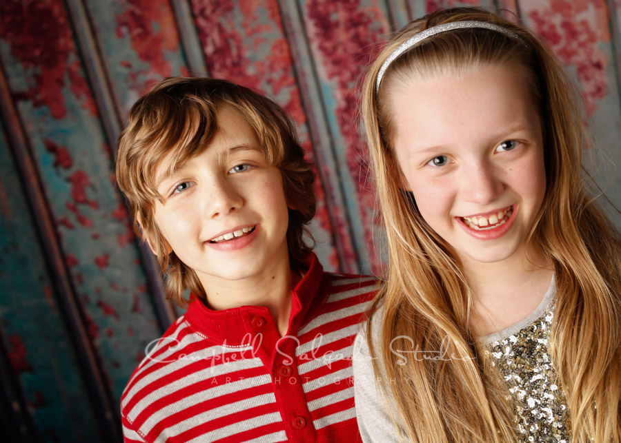  Portrait of siblings on Italian rust background by childrens photographers at Campbell Salgado Studio in Portland, Oregon. 