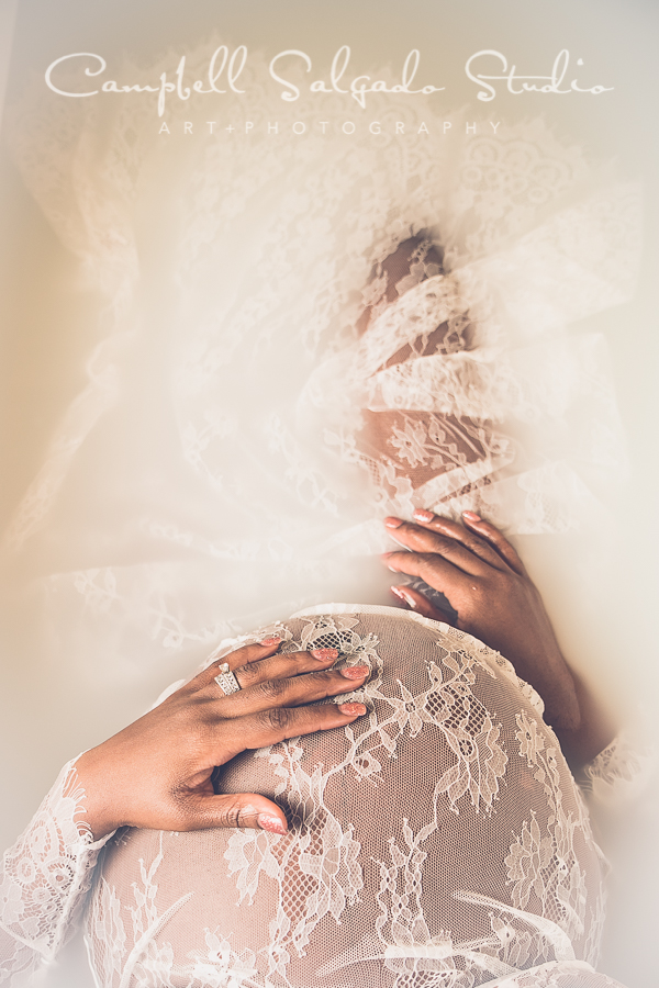  Milk bath maternity photo of a woman wearing white lace at Campbell Salgado Studio in Portland, Oregon. 