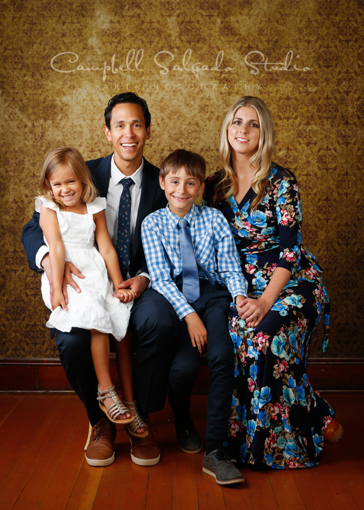  Portrait of family on amber light background by family photographers at Campbell Salgado Studio in Portland, Oregon. 