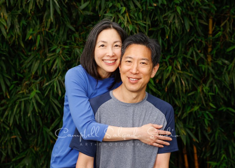  Portrait of couple on bamboo background by couples photographers at Campbell Salgado Studio in Portland, Oregon. 