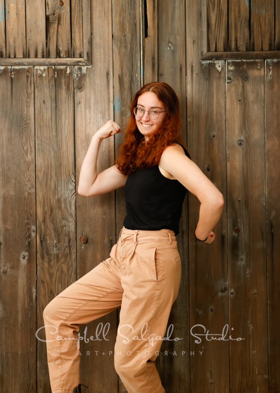  Portrait of teen on barn doors background by teen photographers at Campbell Salgado Studio in Portland, Oregon. 