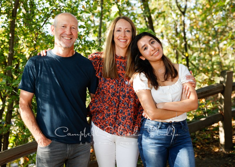  Portrait of family on woodlands background by family photographers at Campbell Salgado Studio in Portland, Oregon. 