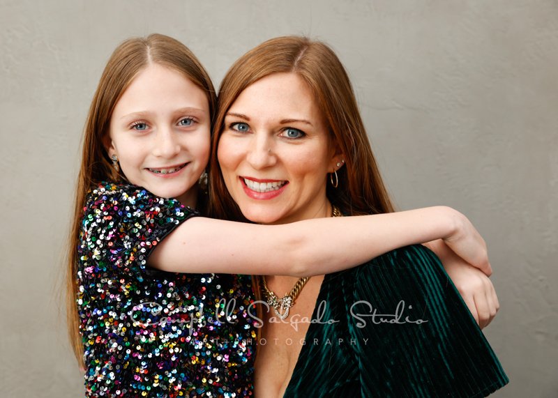  Portrait of mother and daughter on modern grey background by family photographers at Campbell Salgado Studio in Portland, Oregon. 