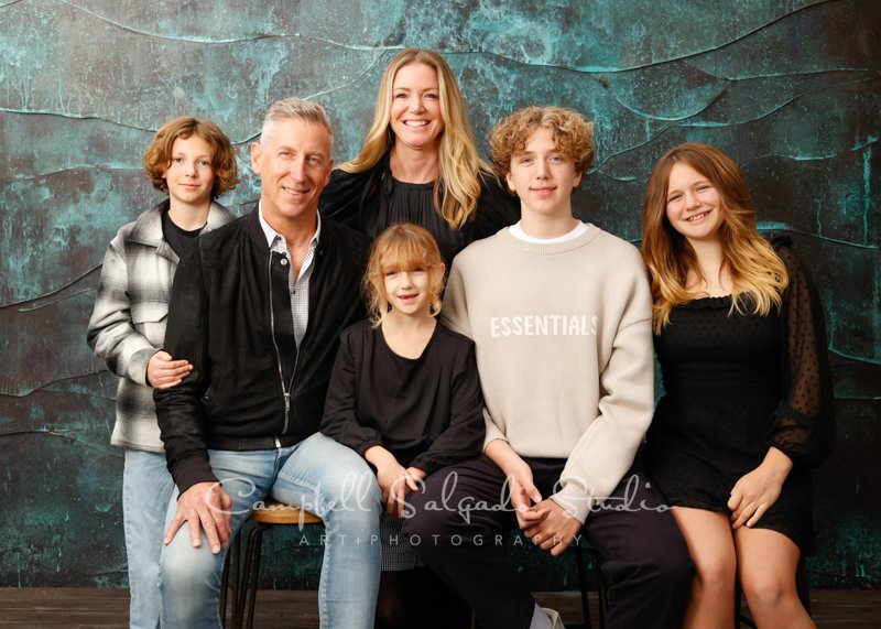 Portrait of family on ocean weave background by family photographers at Campbell Salgado Studio in Portland, Oregon. 