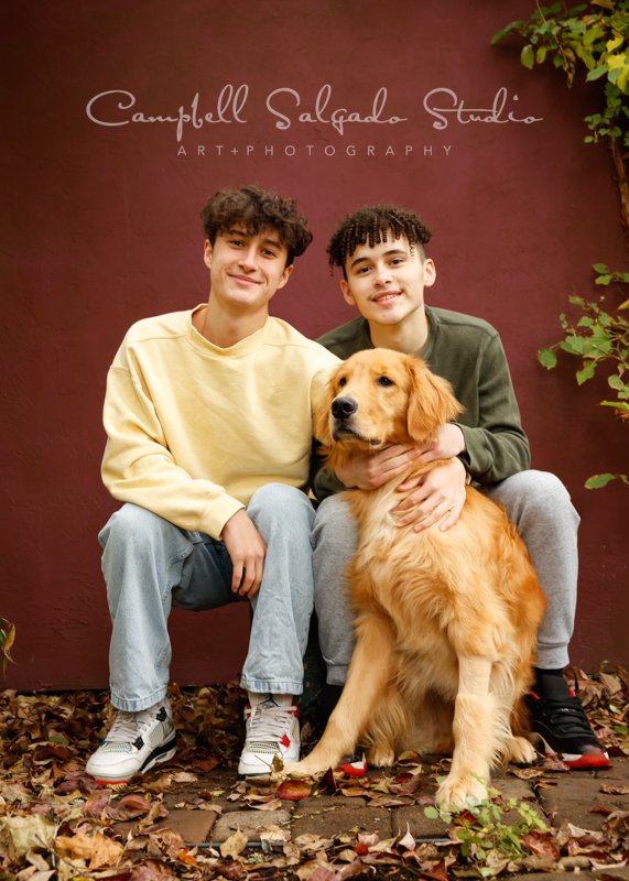  Portrait of brothers on plum stucco background by family photographers at Campbell Salgado Studio in Portland, Oregon. 