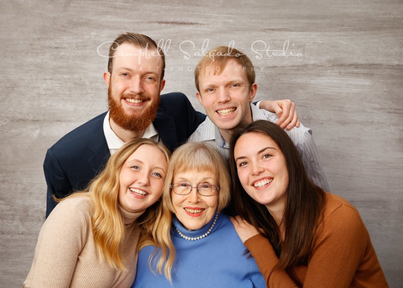  Portrait of multi-generational family on graphite background by family photographers at Campbell Salgado Studio in Portland, Oregon. 